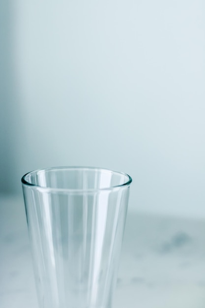 Clean empty glass on marble table