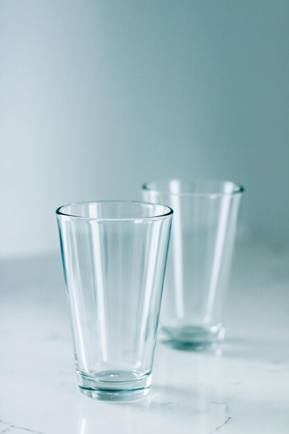 Clean empty glasses on marble table