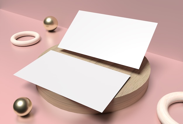 Clean minimal business card on wood plate with golden balls and pastel pink surface