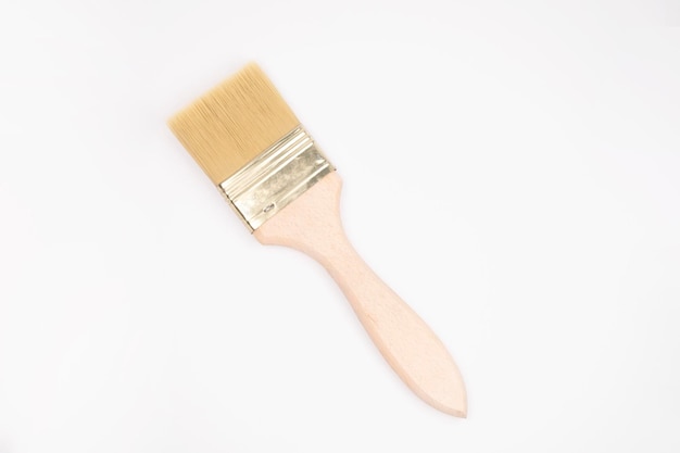 Clean paint brush with wooden handle on white background. Repair brush, for painting walls