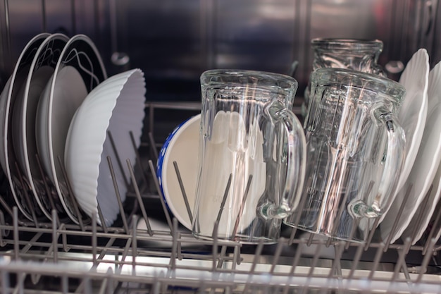 Clean plates and glasses in the dishwasher