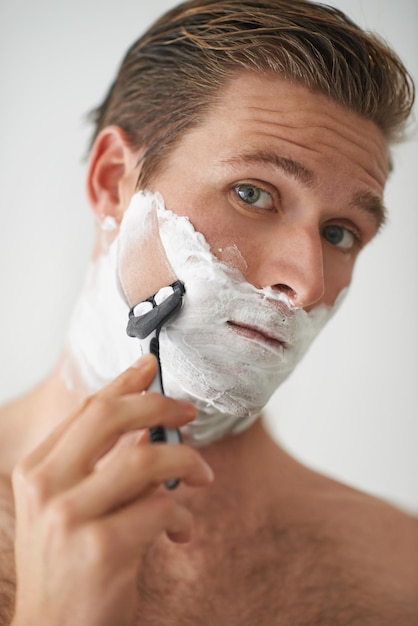 Clean shaven is best A handsome young man shaving