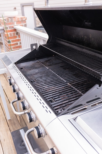 Clean six-burner gas grill ready for summer grilling.