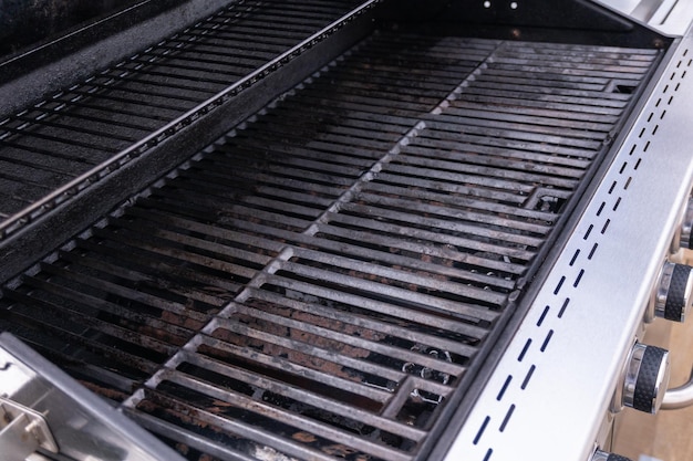 Clean six-burner gas grill ready for summer grilling.