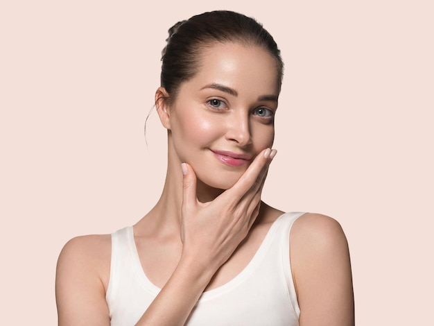 Clean skin woman face natural make up beautiful beauty model. Color background. Pink