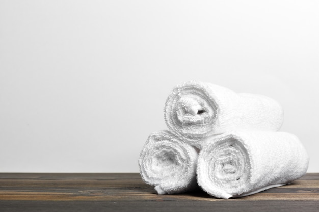 Clean soft towels on wooden table