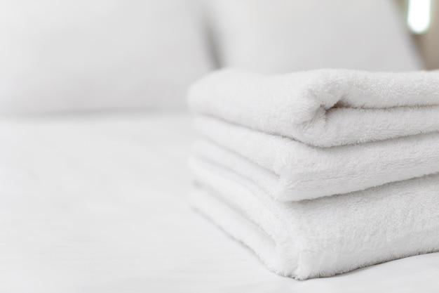 Clean towels on bed at hotel room