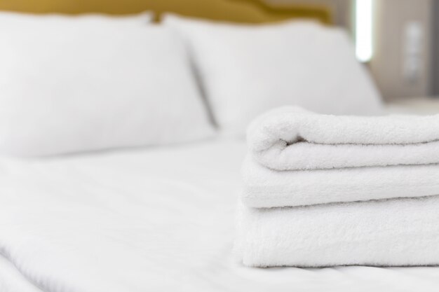 Clean towels on bed at hotel room