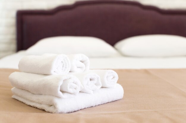 Clean towels on bed at hotel room