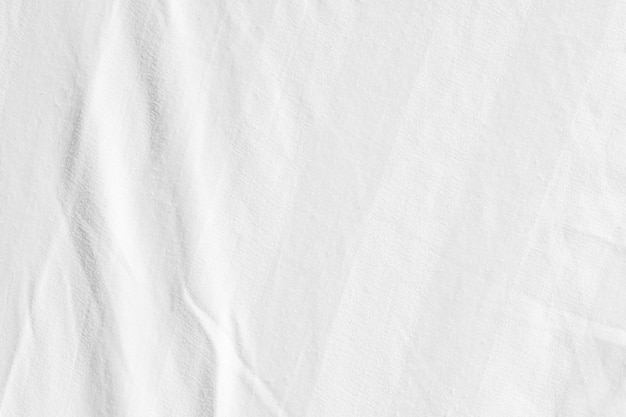 Clean white paper wrinkled background abstract crumpled white paper white bed linen gradient texture blurred curve style of abstract luxury fabricWrinkled bed linen and dark gray shadowsbackground