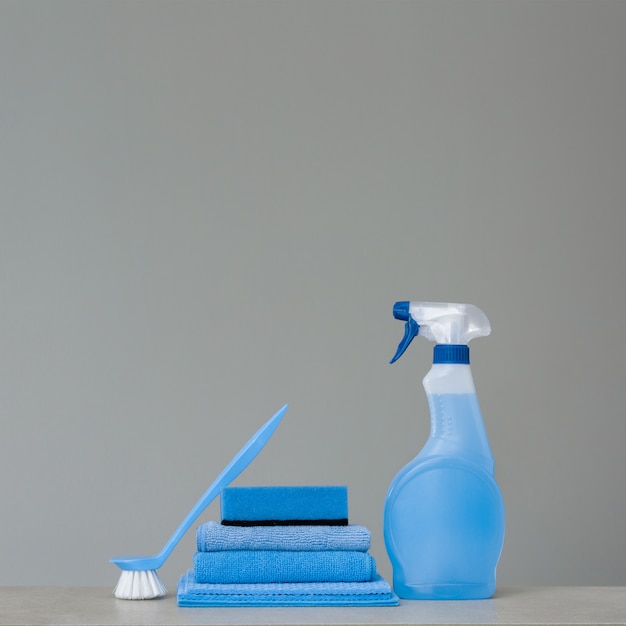 Cleaning blue spray bottle with plastic dispenser