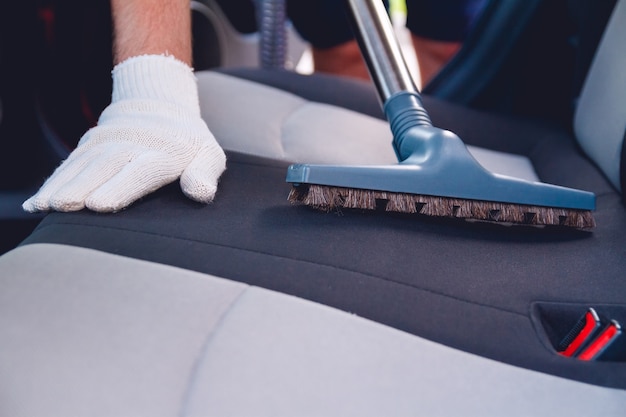 Cleaning the car interior with a vacuum cleaner