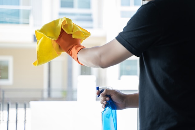 Cleaning company concept man Cleaning the Windows