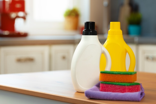 Photo cleaning detergents and tools on a kitchen counter