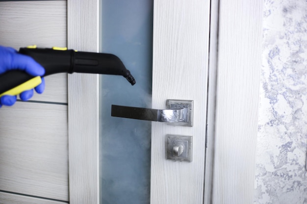 Cleaning and disinfection of the door handle with hot steam Professional cleaning