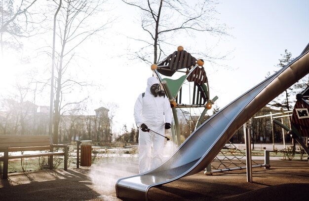 Cleaning and disinfection the playground with spray chemicals\
to preventing the spread of of coronavirus.