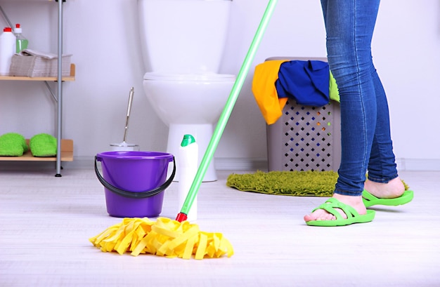 Cleaning floor in room closeup