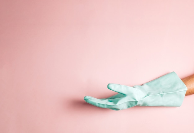 cleaning glove on pink copyspace