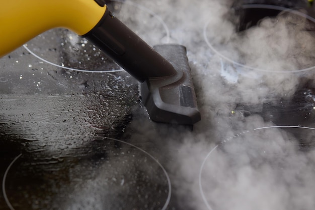 Cleaning of induction cooker with steam cleaner