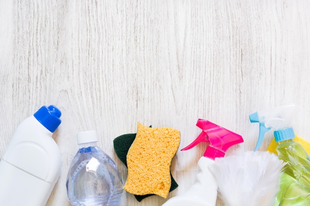 Cleaning items on white wooden table