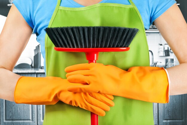 Cleaning maid with a broom house work