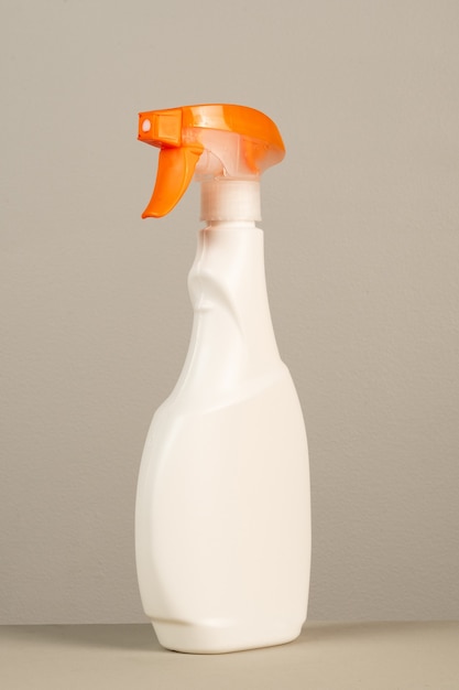 Cleaning product plastic packaging on neutral gray background