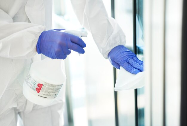 Cleaning product used by a person in safety uniform