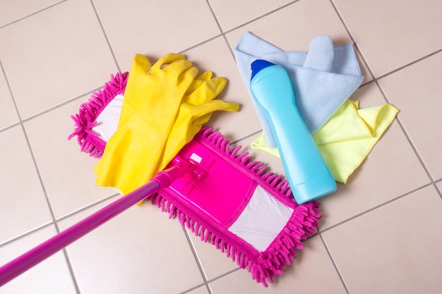 Cleaning products on the tile floor in bathroom