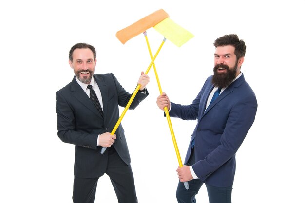 Cleaning service concept. Cover our tracks before someone find out financial fraud. Delete evidence. Clear reputation. Bearded men formal suits hold mops. Big cleaning day. Cleaning business.