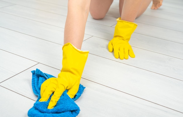 Cleaning service cropped shot of young woman cleaning white
floor with blue cloth cleaning service concept young maid cleaning
floor cheerful cleaning service copy space