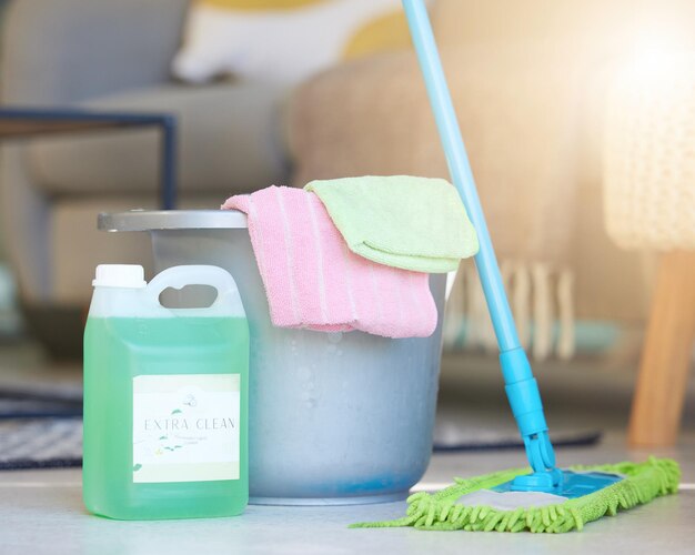 Photo cleaning soap detergent product and bucket with mop for domestic work household chores and sanitizing house to get rid of germs bacteria and dirt clean living room shiny floor and spotless house