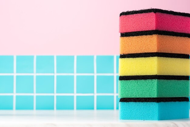 Cleaning sponge on kitchen table Mockup background with copy space