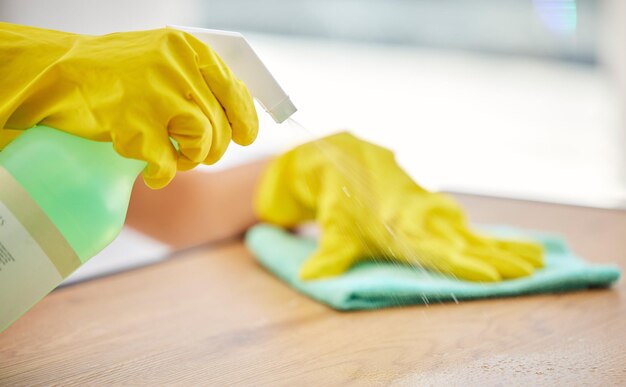 Photo cleaning spray and hands of woman with table furniture for healthcare safety and bacteria dust chemical and product with cleaner and cloth at home for disinfection virus and germs protection