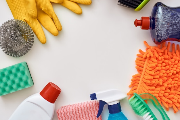 Cleaning tools. Circle from spray bottle and other items isolated at the bottom of the picture