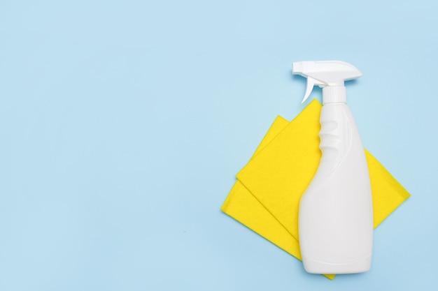 cleaning tools. empty place for text or logo on blue background