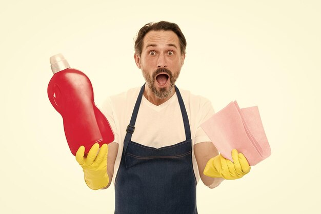 Cleaning tricks and tips Cleaning service and household duty Man in rubber gloves hold bottle liquid soap chemical cleaning agent Bearded guy cleaning home Cleanup concept Get rid of stains