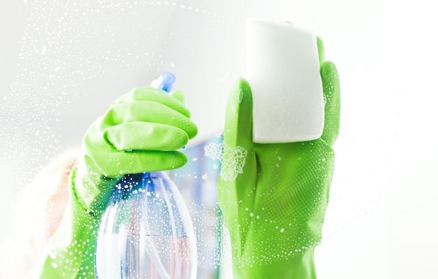 Cleaning window pane with detergent, cleaning concept