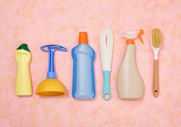 cleaning with various accessories and detergents top view of plunger and brushes cleaning agents