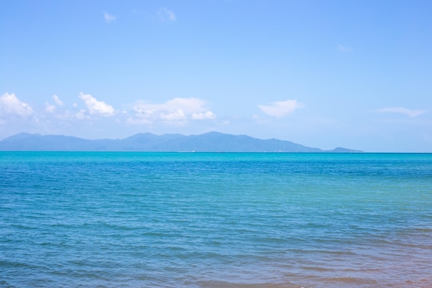 Clear blue sea on the horizon mountains and sky sea beautiful landscape travel and tourism