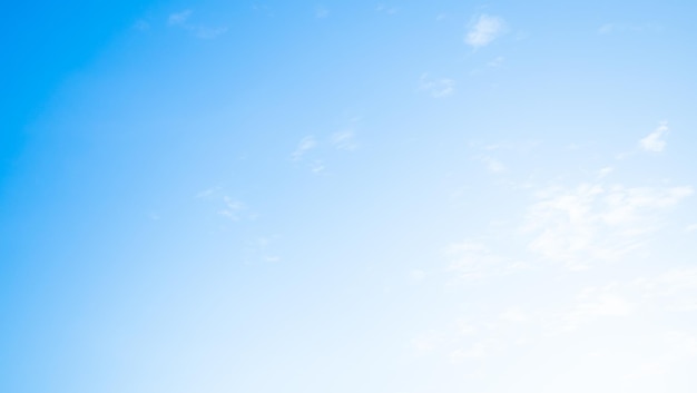 A clear blue sky with a white cloud in the middle.