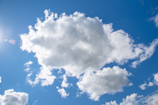 Clear blue sky with white clouds, background