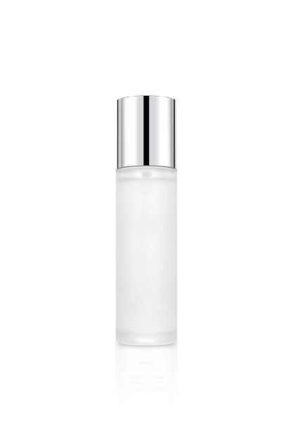 A clear bottle of perfume with a silver cap