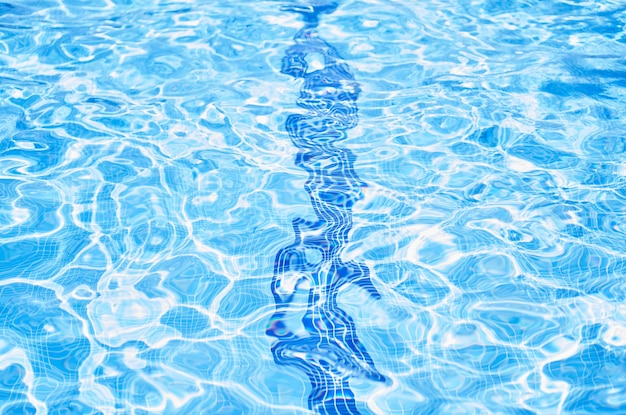 Clear crystal azure pure transparent water of a swimming pool on a sunny day