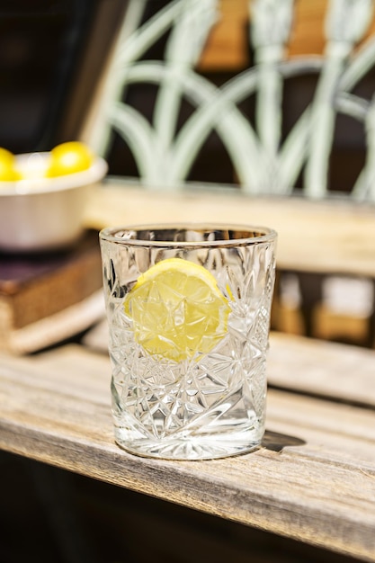 A clear cut glass goblet filled with water