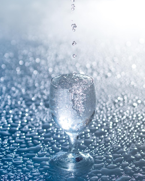 A clear fresh cold water is poured into a glass