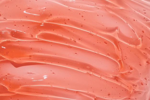 Фото Прозрачная текстура гелевой сыворотки жидкий фон крема для ухода за кожей косметический гелевый продукт с пузырьками вблизи