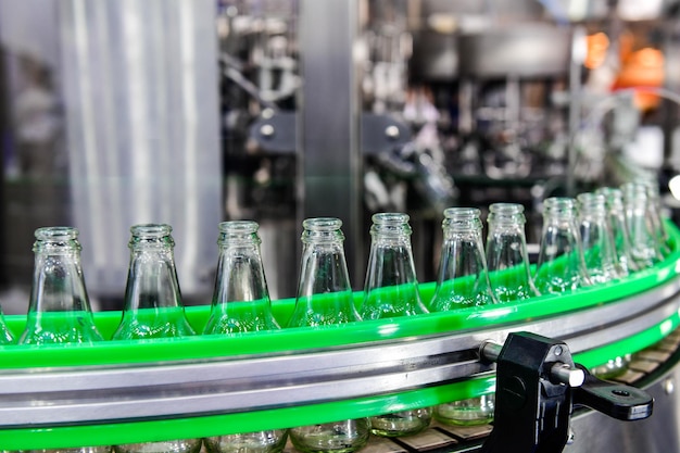 Clear glass bottles transfer on Automated conveyor systems industrial automation for package