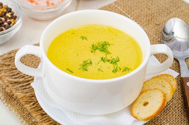 Clear meat, chicken broth in white bowl