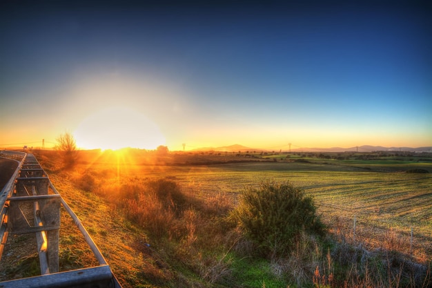 Clear sky over the countryside at sunset