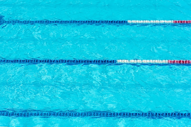 Clear transparent swimming pool water background. Selective focus